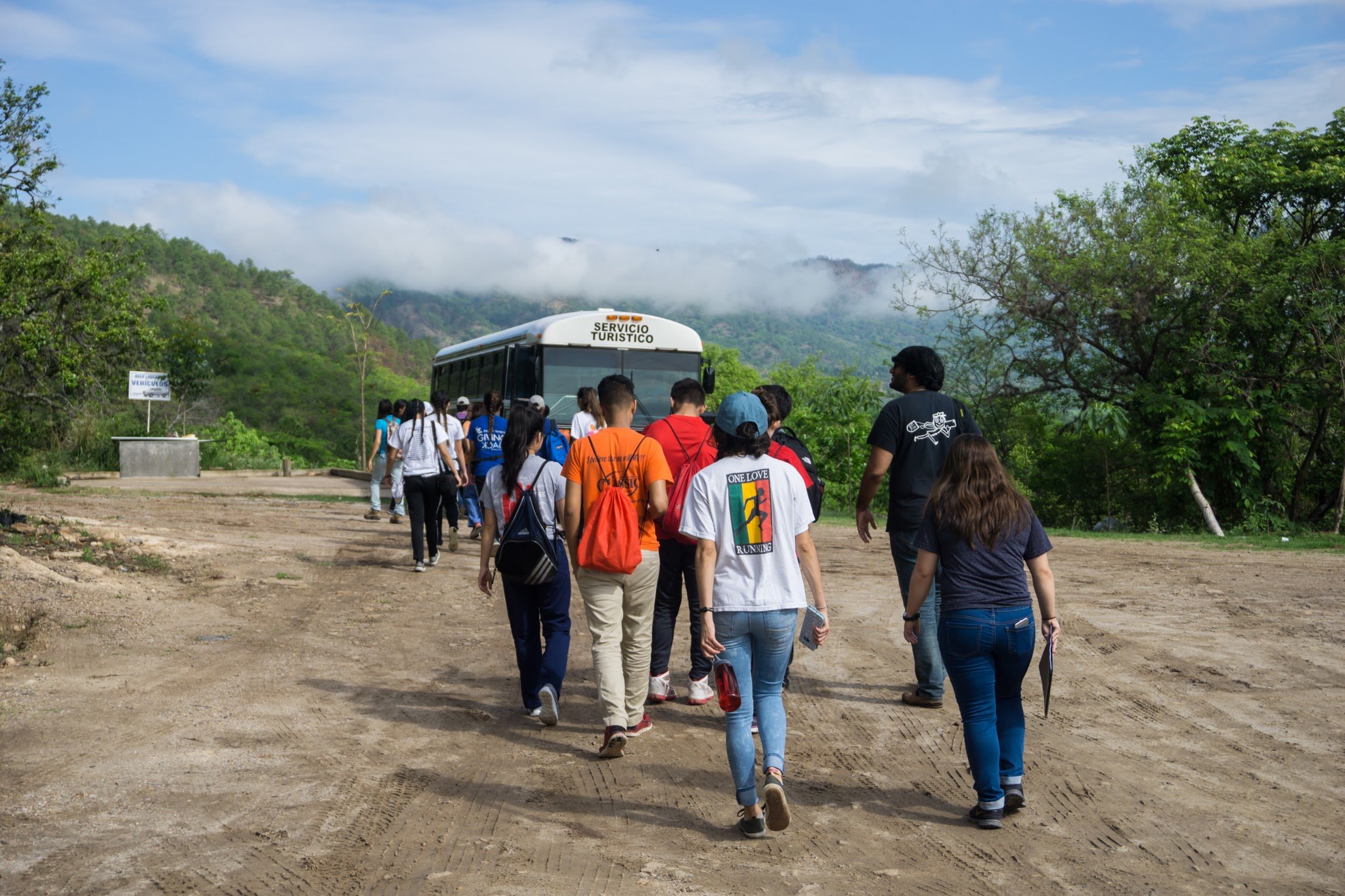 GB volunteers walking towards bus