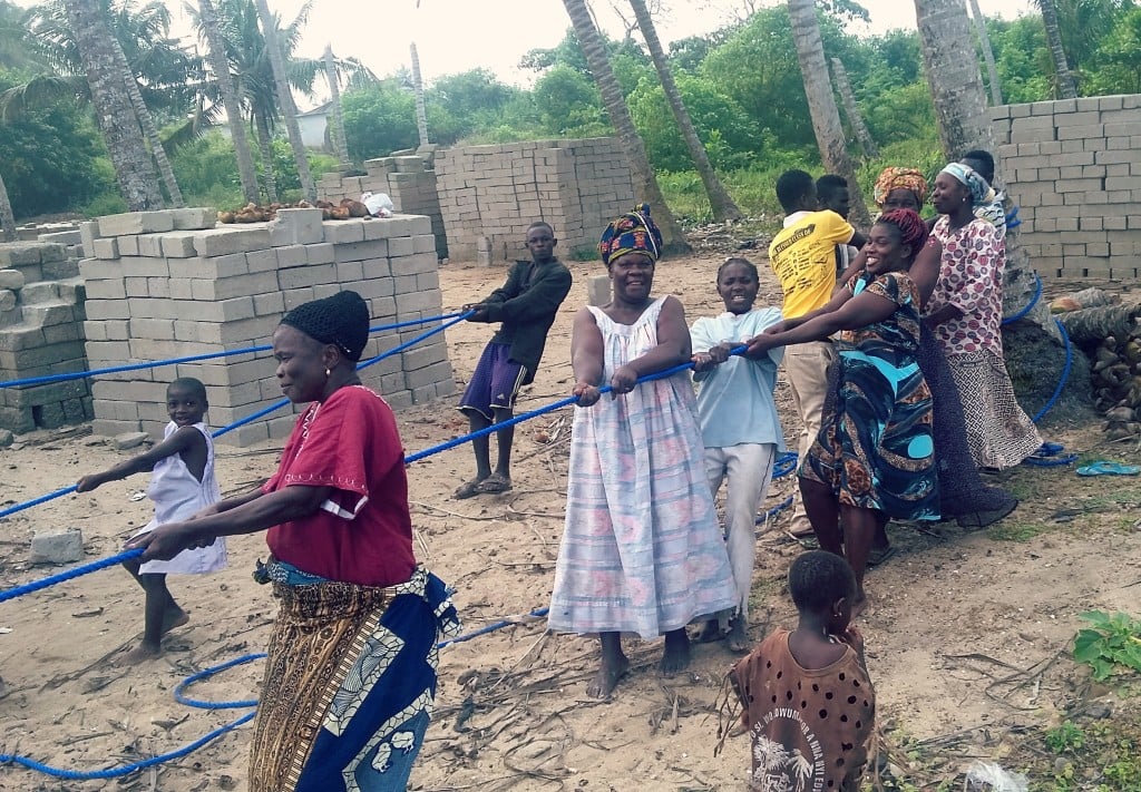 The entire Aboano community came out to pull their boat ashore.